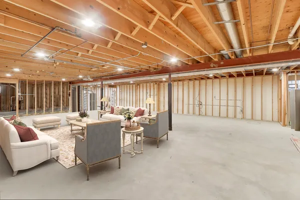 a living room with furniture and a chandelier