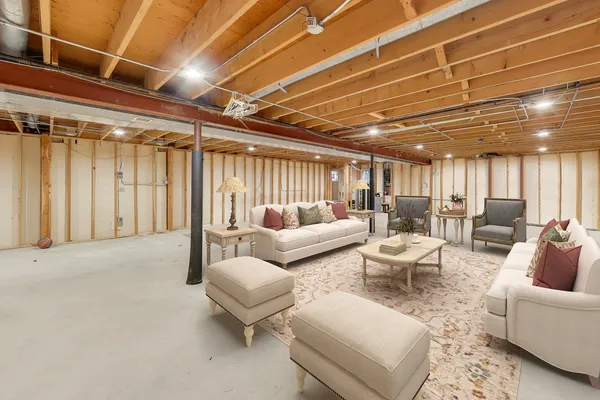 a living room with furniture and a chandelier