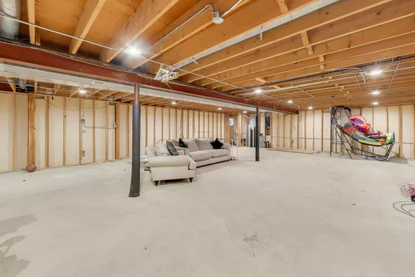 a view of a empty room with a couch