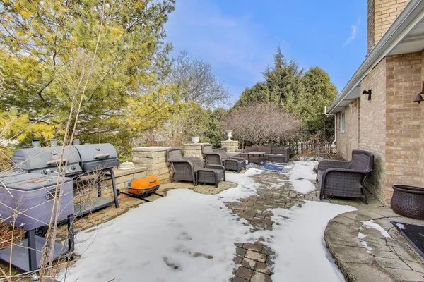 a outdoor space with patio couch and a fire pit
