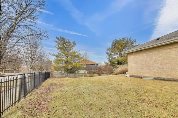 a view of large yard with large trees