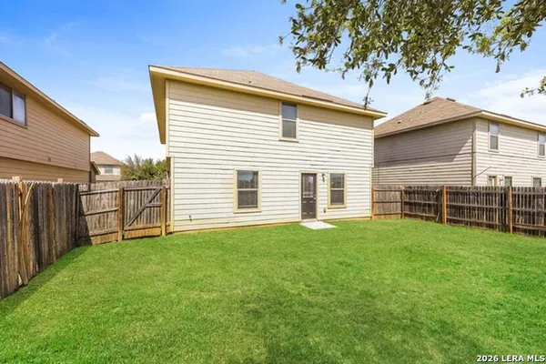 a view of a backyard with a small cabin