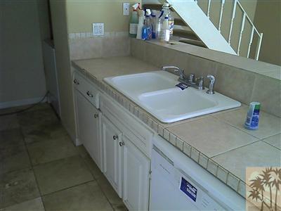 72724 Eagle Road, Unit 3 Palm Desert, CA 92260 - Photo 11 of 11 a bathroom with a sink and a mirror