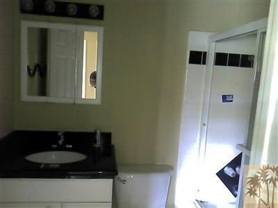 72724 Eagle Road, Unit 3 Palm Desert, CA 92260 - Photo 7 of 11 a bathroom with a sink and a mirror