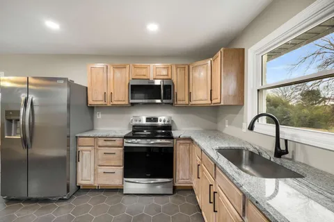 a bathroom with a bathtub and toilet