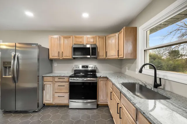 a bathroom with a bathtub and toilet