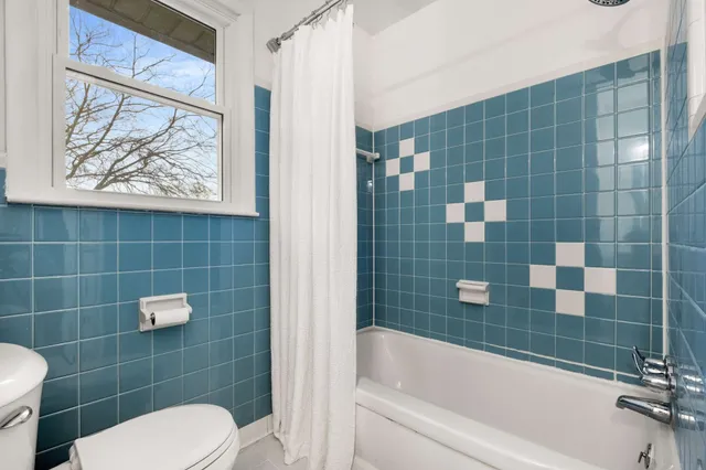 a bathroom with a sink a mirror and a shower