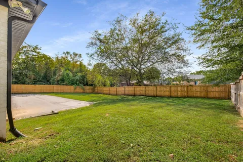 a view of a house with a big yard