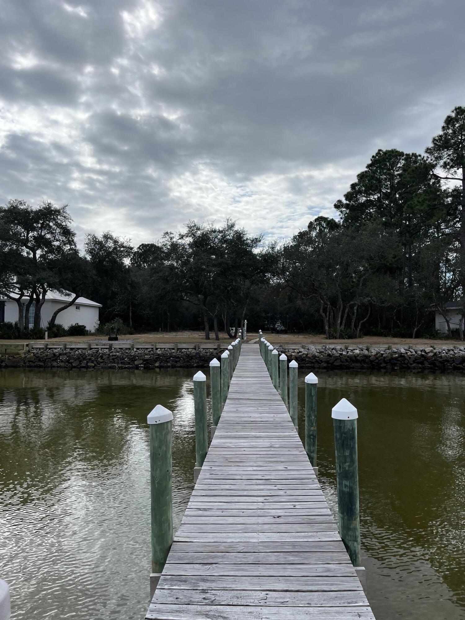 431 Pisces Drive Santa Rosa Beach, FL 32459 - Photo 15 of 19 a lake view with a wooden bridge
