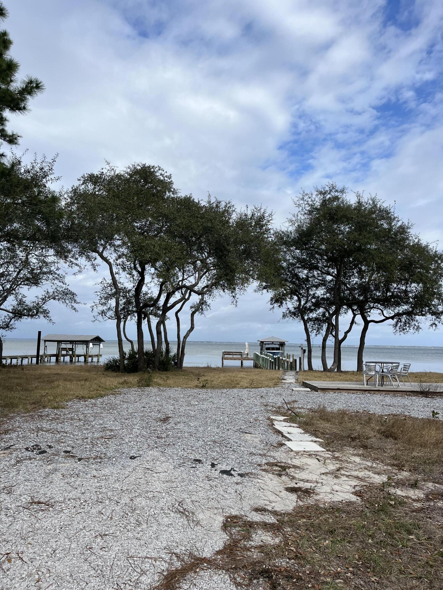 431 Pisces Drive Santa Rosa Beach, FL 32459 - Photo 3 of 19 a view of dirt yard with a large tree