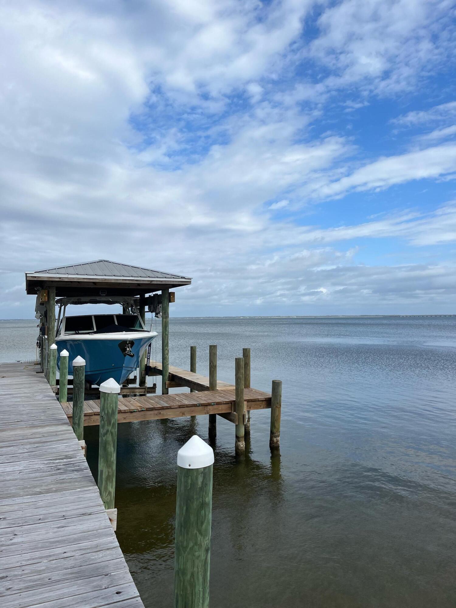431 Pisces Drive Santa Rosa Beach, FL 32459 - Photo 9 of 19 a roof deck with table and chairs