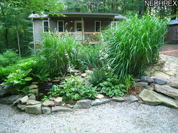 2040 Scroll Road Southwest Carrollton, OH 44615 - Photo 3 of 25 CABIN HAS ELECTRIC HEAT AND WINDOW A/C. ALSO HAS A BASEMENT FOR STORAGE!