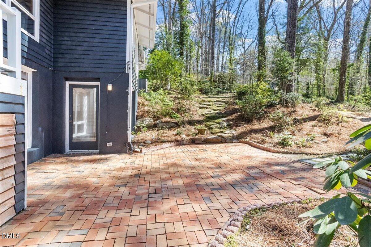 4805 Rembert Drive Raleigh, NC 27612 - Photo 43 of 45 a view of a house with a yard