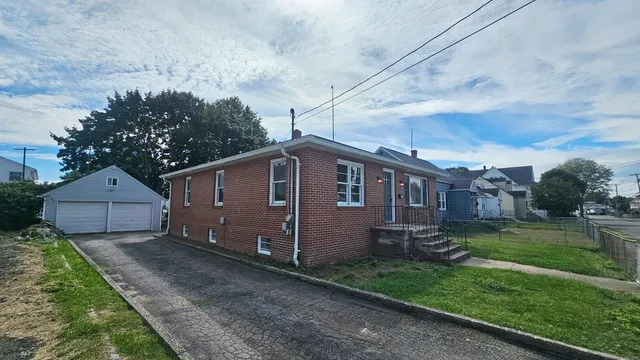 a backyard of a house with lots of green space