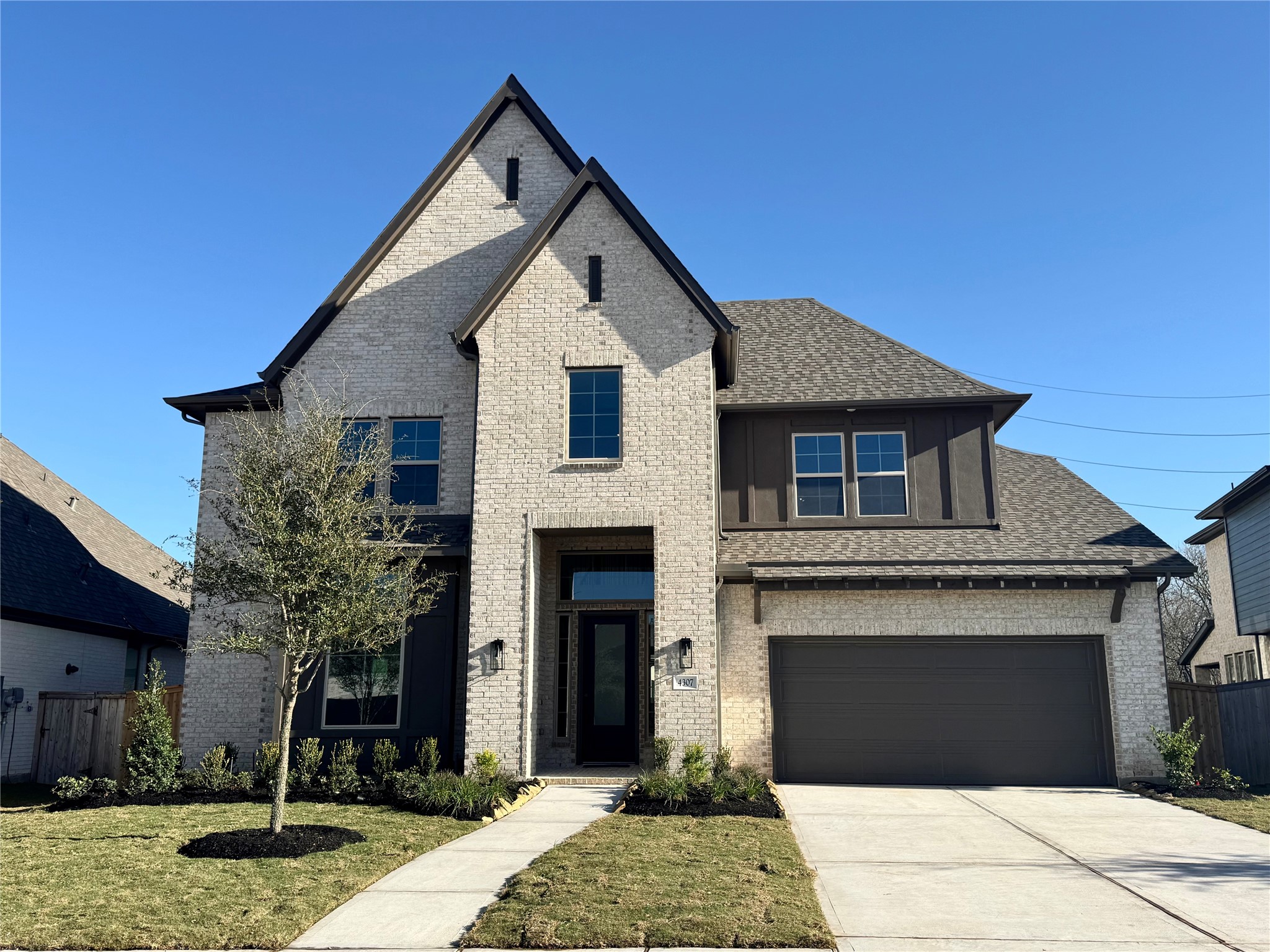 4307 Southpoint Way Fulshear, TX 77441 - Photo 1 of 18 a front view of a house with garden