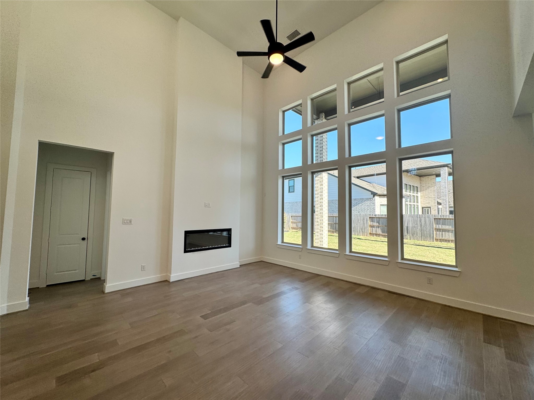 4307 Southpoint Way Fulshear, TX 77441 - Photo 4 of 18 wooden floor in an empty room with a window