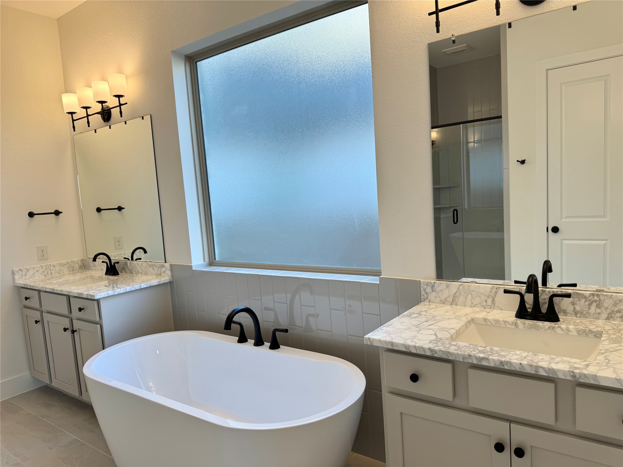 4307 Southpoint Way Fulshear, TX 77441 - Photo 7 of 18 a bathroom with a granite countertop sink and a mirror