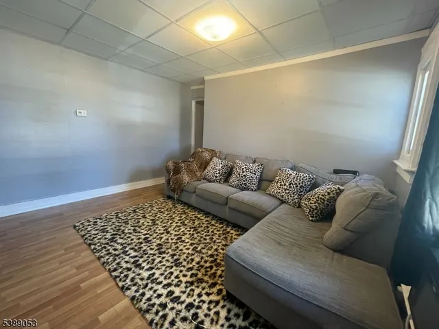 a living room with a couch and a rug