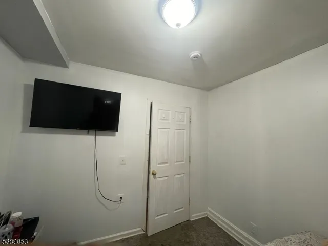 a room with a wooden floor and a chair