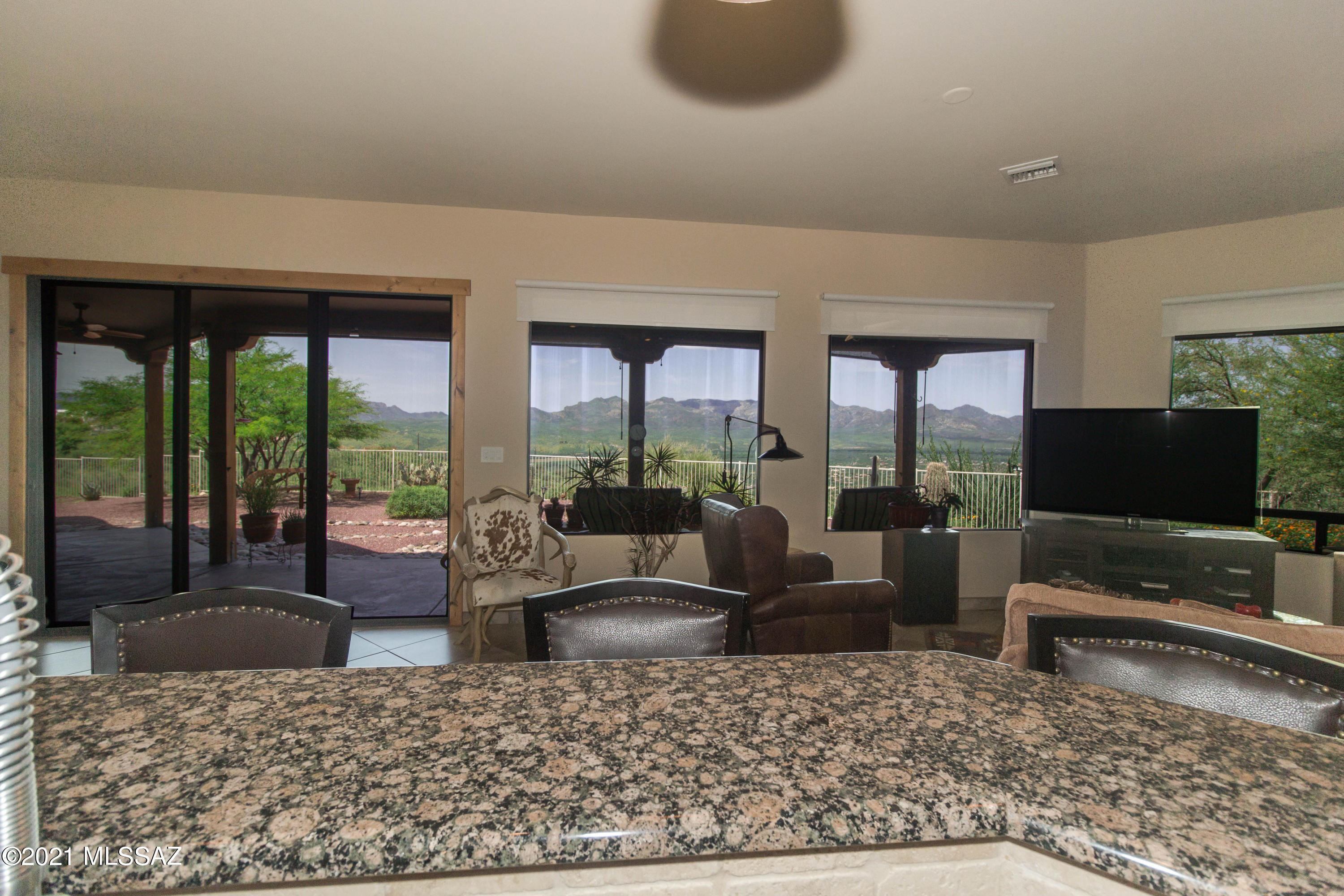 1567 Camino Esturion Rio Rico, AZ 85648 - Photo 27 of 41 a living room with furniture tv and large window