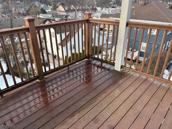 a view of a balcony with wooden floor