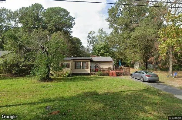 a view of a house with a back yard