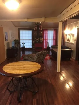 a view of a room with table and chairs