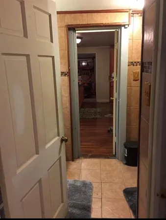 a bathroom with a shower and a mirror