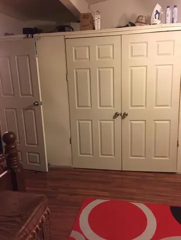 a view of a livingroom with wooden floor