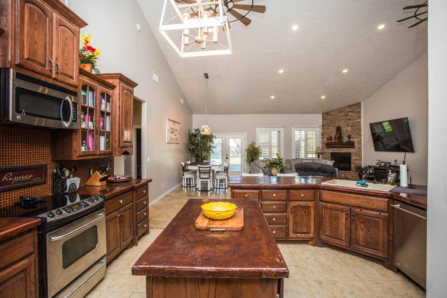 7516 66th Street Lubbock, TX 79407 - Photo 12 of 50 a kitchen with lots of counter top space and stainless steel appliances