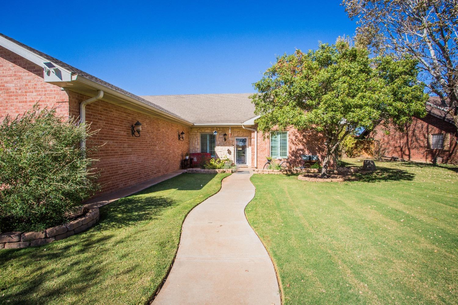 7516 66th Street Lubbock, TX 79407 - Photo 4 of 50 a view of swimming pool with a backyard