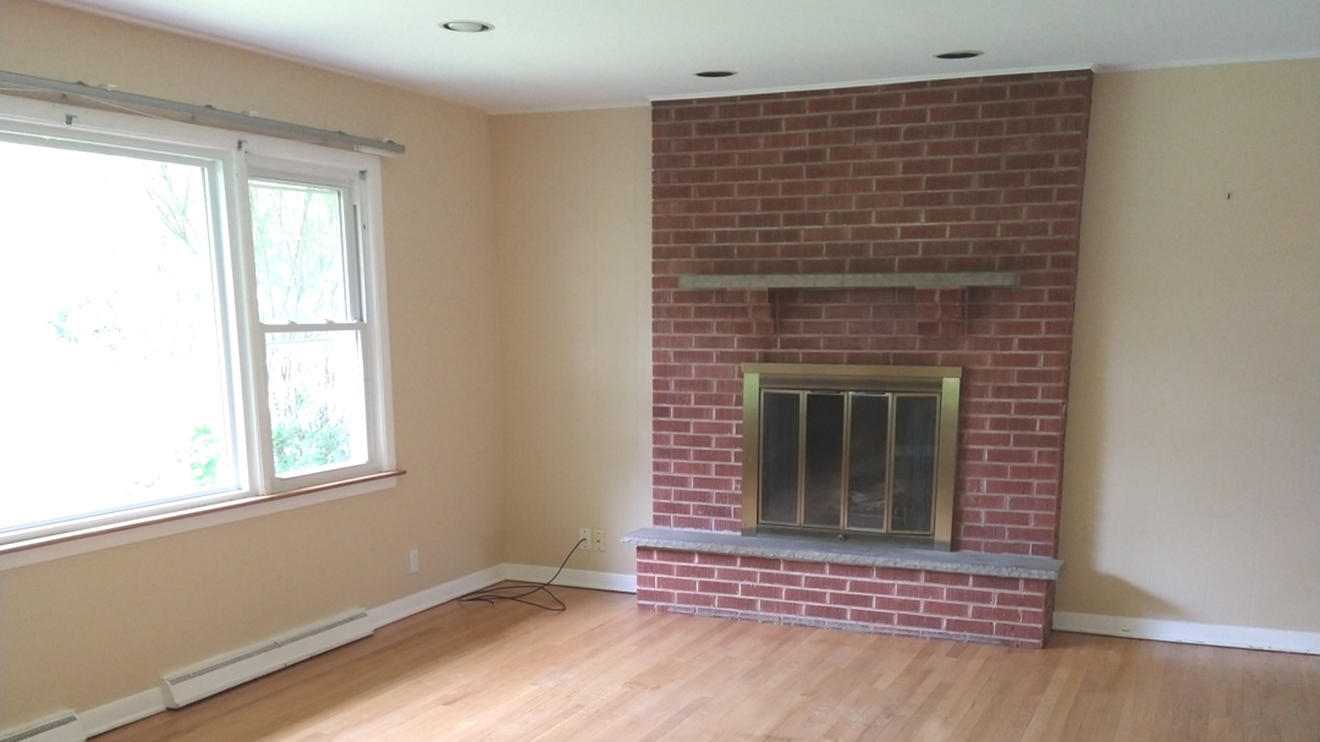 241 Red Oak Road Northbrook, IL 60062 - Photo 3 of 11 a view of an empty room with wooden floor and a window