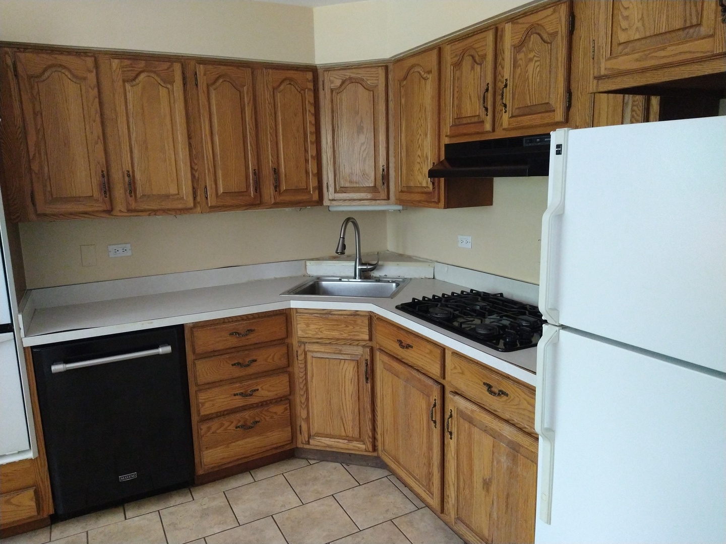 241 Red Oak Road Northbrook, IL 60062 - Photo 6 of 11 a kitchen with granite countertop cabinets and stainless steel appliances