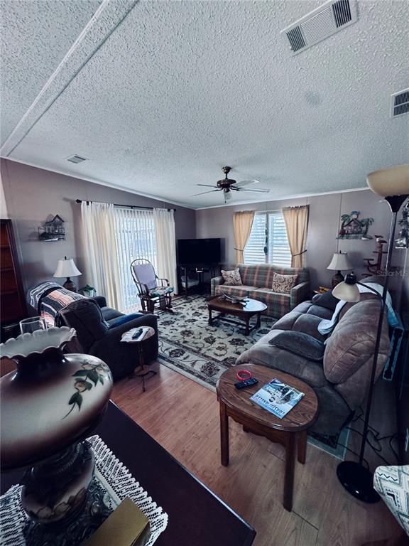 4339 Mackeral Circle Edgewater, FL 32141 - Photo 14 of 33 a living room with furniture and a wooden floor