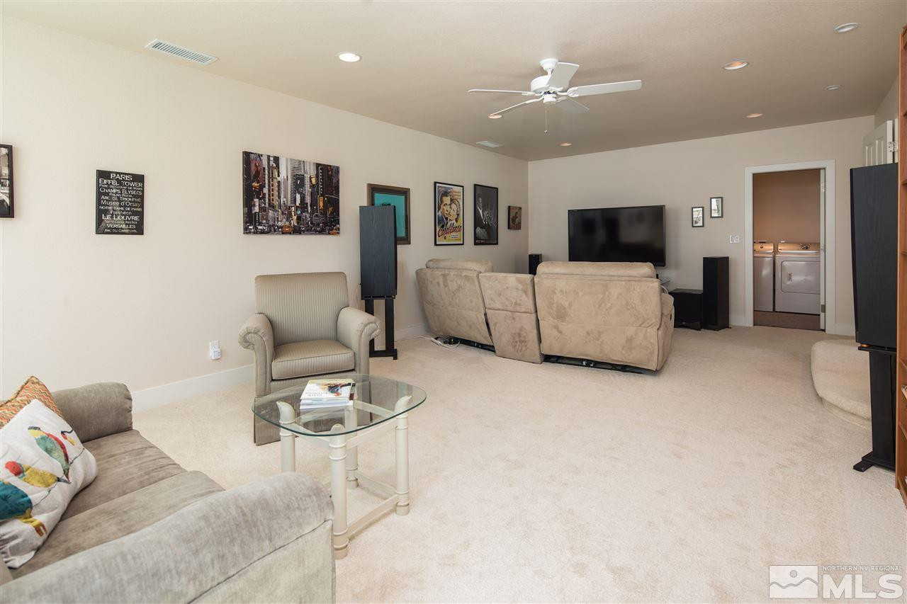 2769 Mountain Springs Road Reno, NV 89519 - Photo 13 of 25 a living room with furniture and a flat screen tv