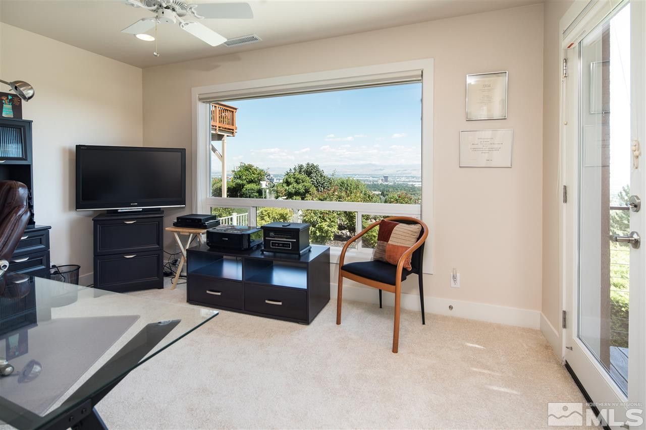 2769 Mountain Springs Road Reno, NV 89519 - Photo 16 of 25 a living room with furniture and a flat screen tv