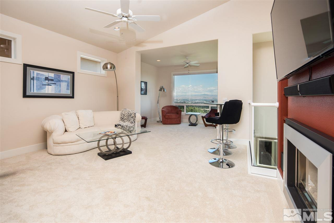 2769 Mountain Springs Road Reno, NV 89519 - Photo 8 of 25 a living room with furniture and a flat screen tv