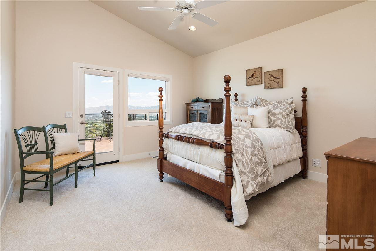 2769 Mountain Springs Road Reno, NV 89519 - Photo 10 of 25 a bedroom with a bed chair and window