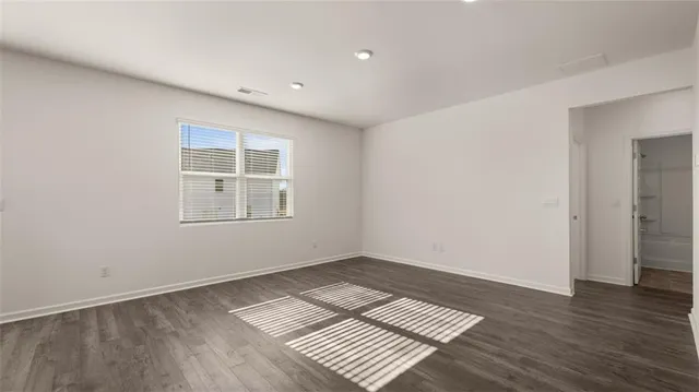 a view of wooden floor in an empty room