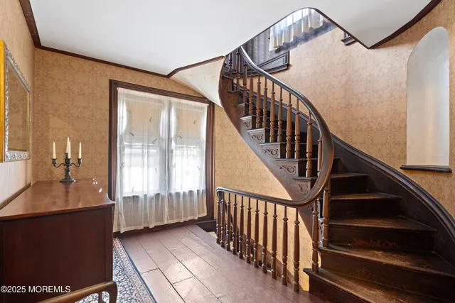 a white toilet sitting next to a bathroom sink