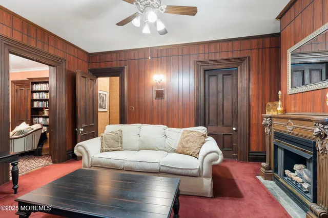 a dining room with a wooden table and chairs