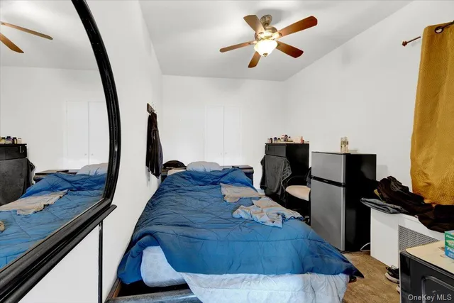 a view of a workspace with furniture and wooden floor
