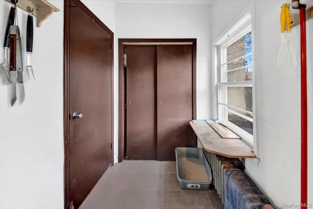 a balcony with table and chairs