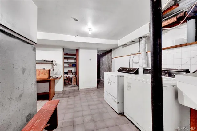 a kitchen with a refrigerator and a stove top oven