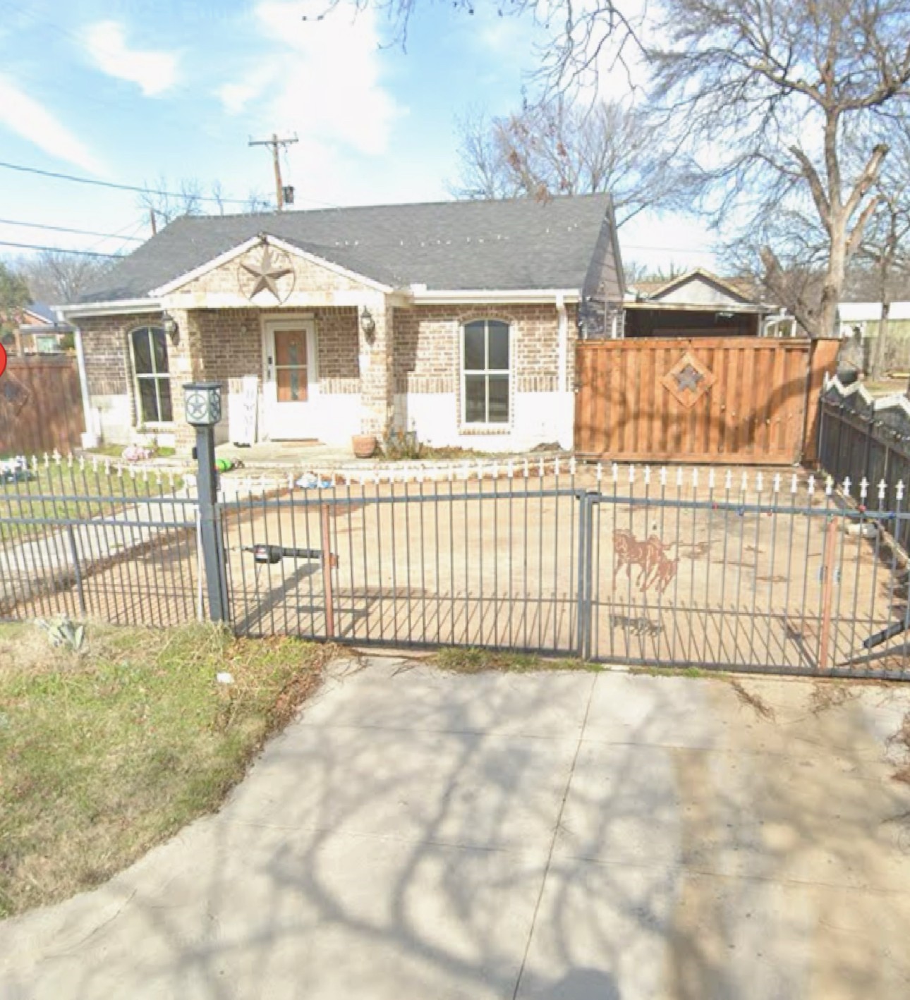 3701 Forbes Street Fort Worth, TX 76105 - Photo 5 of 6 a front view of a house with a iron fence