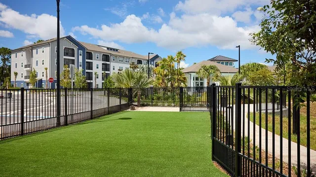 a view of a house with backyard and porch