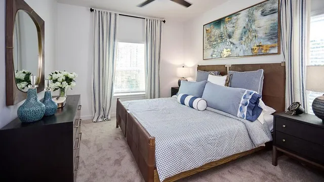 a bedroom with bed and wooden floor