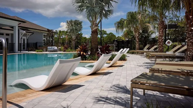 a view of a swimming pool with a sitting space