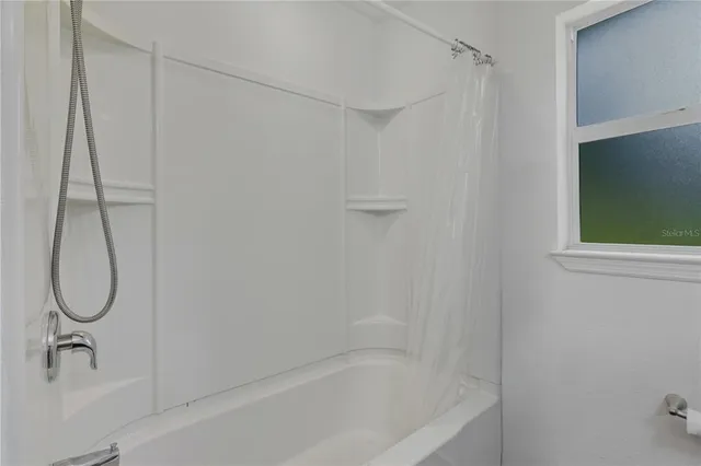 a bathroom with a bath tub