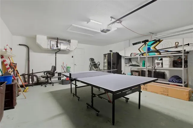 a room with lots of furniture and a chandelier